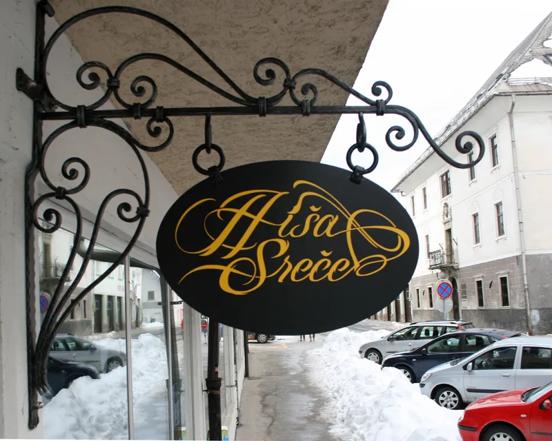 Kovan izvesek Hiša sreče